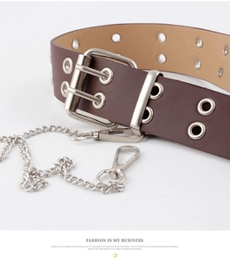 Detail of dark brown PU leather belt with silver double-pin buckle and punk metal chain