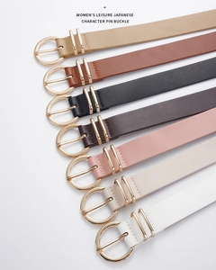 Detail showing various colors of PU leather belts with golden metal pin buckles