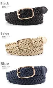 Close-up of woven braided belts in black, yellow, and blue with gold square buckles