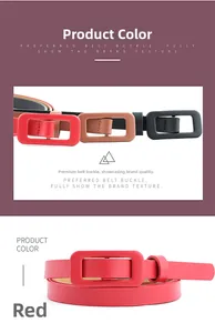 Close-up of thin patent leather belts in red, brown, and black with rectangular buckles
