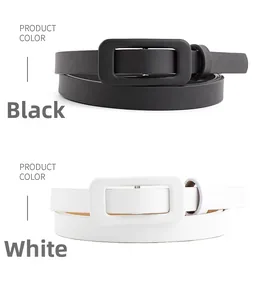 Close-up of minimalist skinny belts in black and white colors with rectangular buckles