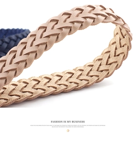 Detailed close-up of khaki woven leather belt featuring fine braided texture and square buckle