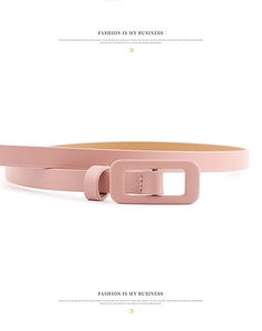 Detail shot of the light pink patent leather texture and color-matched square buckle