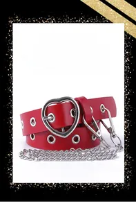 Close-up of bright red leather belt with silver heart buckle and metal chain detail