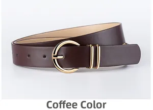 Close-up of smooth coffee PU leather belt featuring a polished golden horseshoe buckle