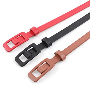 Minimalist patent leather skinny belts in red, black, and brown for stylish women's dresses