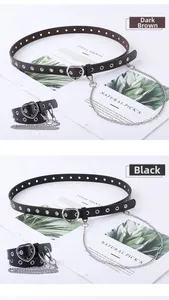 Detail of trendy punk belts with heart-shaped silver buckles and removable metal chains