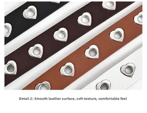 Détail de ceintures en cuir avec œillets métalliques en forme de cœur multicolores