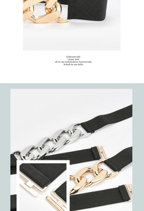 Detail showing the heavy metal chain buckle and elastic black woven texture on the belt
