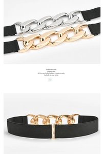 Close-up of women's elastic waist belt with large metal chain link and buckle details