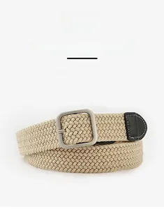 Close-up of khaki woven elastic belt with silver square buckle and black leather tip