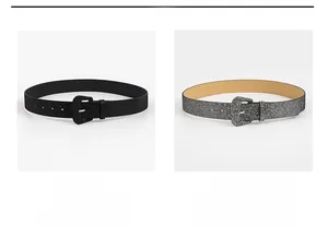 Close-up of glitter finish fashion belts in black and silver with matching buckles