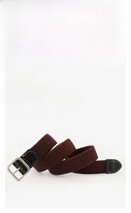 Detail of stretch woven canvas belt with silver matte buckle and varied color swatches