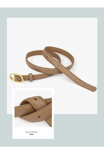 Détail de ceinture en cuir kaki avec boucle dorée texturée et coutures de précision