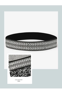 Rhinestone elastic belt detail view, sparkling crystal embellishment on black stretch band.