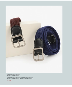 Detail of woven elastic canvas belts in burgundy and navy with matte silver buckles