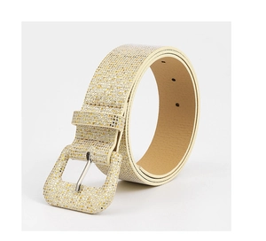 Detailed view of women's belt with gold glitter texture and matching wrapped buckle