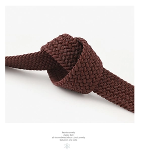 Close-up detail of dark brown woven elastic belt showing durable braided texture and knots