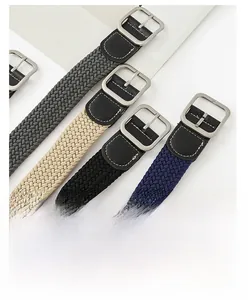 Detailed macro view of multi-color woven elastic belts with square metal buckles
