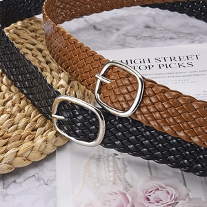 Women's woven PU leather belts in black and brown with polished silver metal buckles