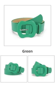 Detail of green leather belt featuring a large wavy buckle with silver pin closure