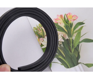 Close-up of black flexible decorative belt showing high elasticity and soft texture