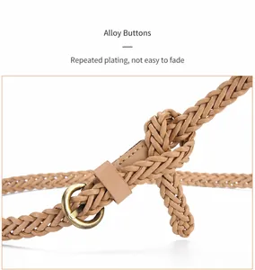 Detailed macro view of camel woven belt with vintage round bronze alloy buckle