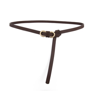 Elegant brown slim leather belt for women with a gold metal double ring buckle on white background
