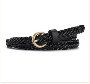 Close-up of black braided leather belt featuring a vintage round bronze metal buckle