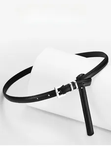 Detail of a thin black leather belt with a silver square buckle tied in a creative knot