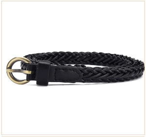 Close-up of black braided waist belt with vintage bronze round buckle for dresses