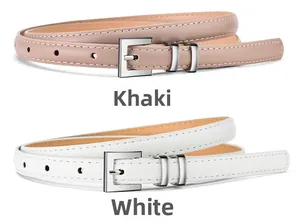 Detail view of thin khaki and white leather belts with silver metal buckles for dresses