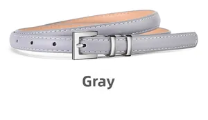 Close-up of minimalist grey leather belt with silver pin buckle and white stitching details