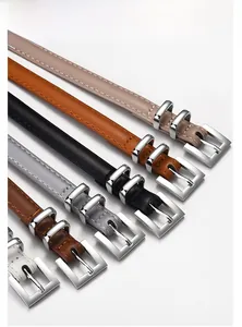 Detail showing various colors of skinny belts with polished zinc alloy buckles