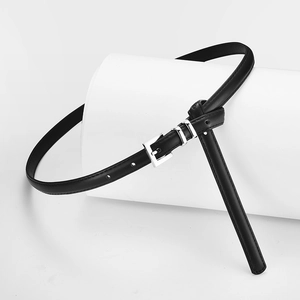 Elegant thin black leather belt for women with silver square buckle on white background