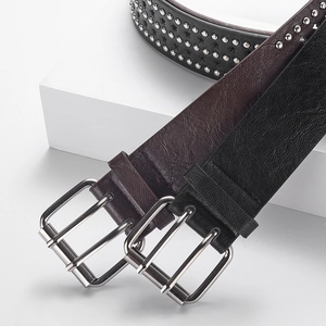 Punk style wide leather belts with metal rivets and double prong buckles in black and brown