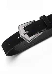 Close-up of hexagonal silver matte buckle on a black suede leather belt for women