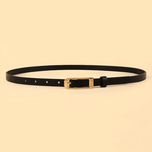 Detail of slim black leather belt featuring a polished gold rectangular alloy pin buckle