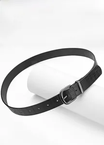 Macro detail of black crocodile embossed faux leather belt with metal pin buckle