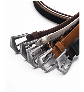 Detail showing five assorted vintage belts with unique pentagon metal buckles in a macro view