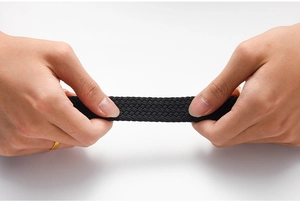 Close-up showing the high elasticity and durable woven texture of this black stretch belt