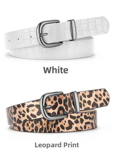 Detail view of white crocodile pattern and leopard print faux leather belts with metal pin buckles