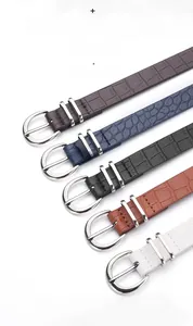 Detail of five high quality crocodile pattern leather belts with silver metal pin buckles