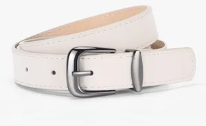 Detail of minimalist beige faux suede belt with rounded dark metal buckle for women