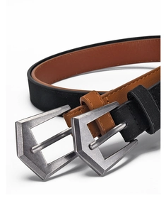 Detail of vintage matte PU leather belts in black and brown with antique metal buckles