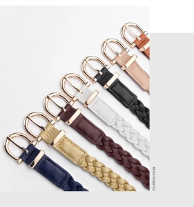 Detailed view of woven leather belts in seven colors with vintage gold metal buckles