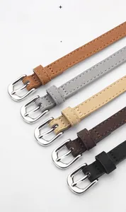 Detail of high quality cowhide leather belts with polished silver buckles in five colors