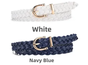Detail view of woven leather belts in white and navy blue with golden horseshoe buckles