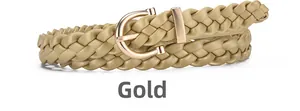 Close-up of golden braided leather belt with a polished U-shaped metallic buckle for women