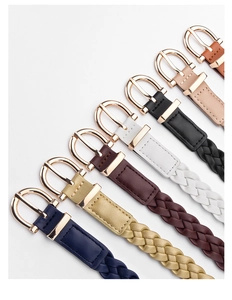 Detail view of woven leather belts in seven colors with elegant gold metal buckles